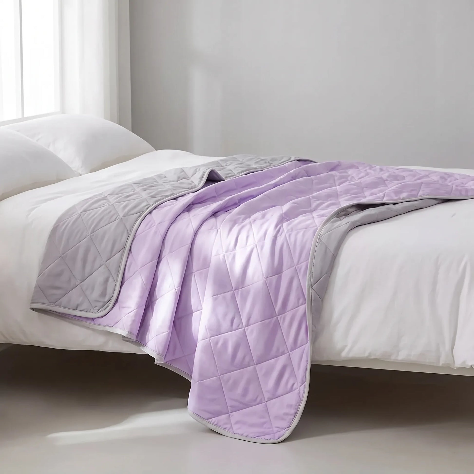 Breathable cooling blanket spread on a bed