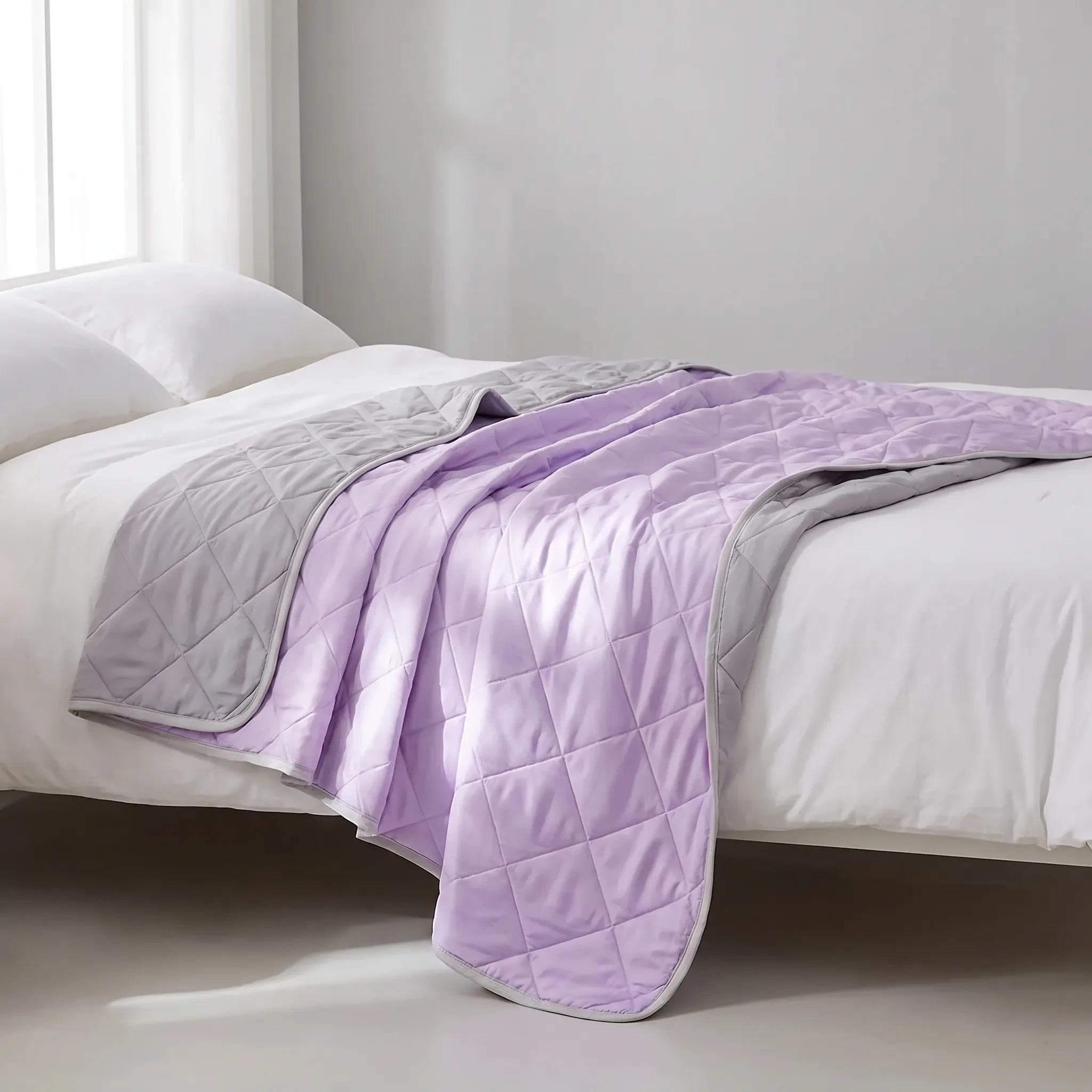 Breathable cooling blanket spread on a bed
