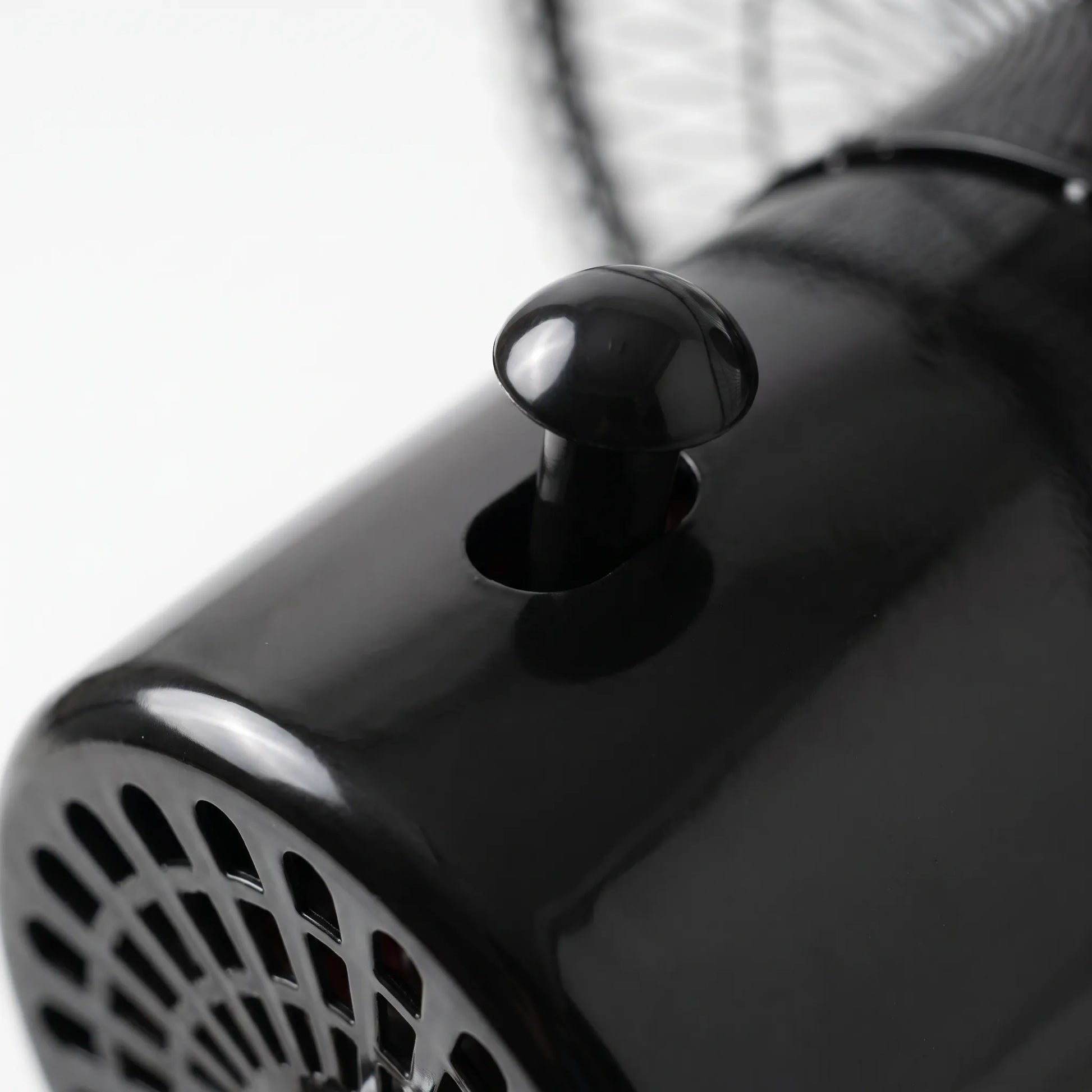 Black and silver standing fan