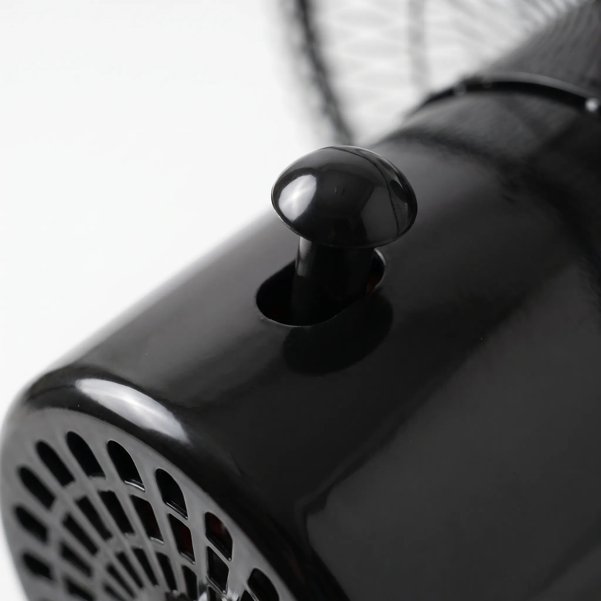 Black and silver standing fan