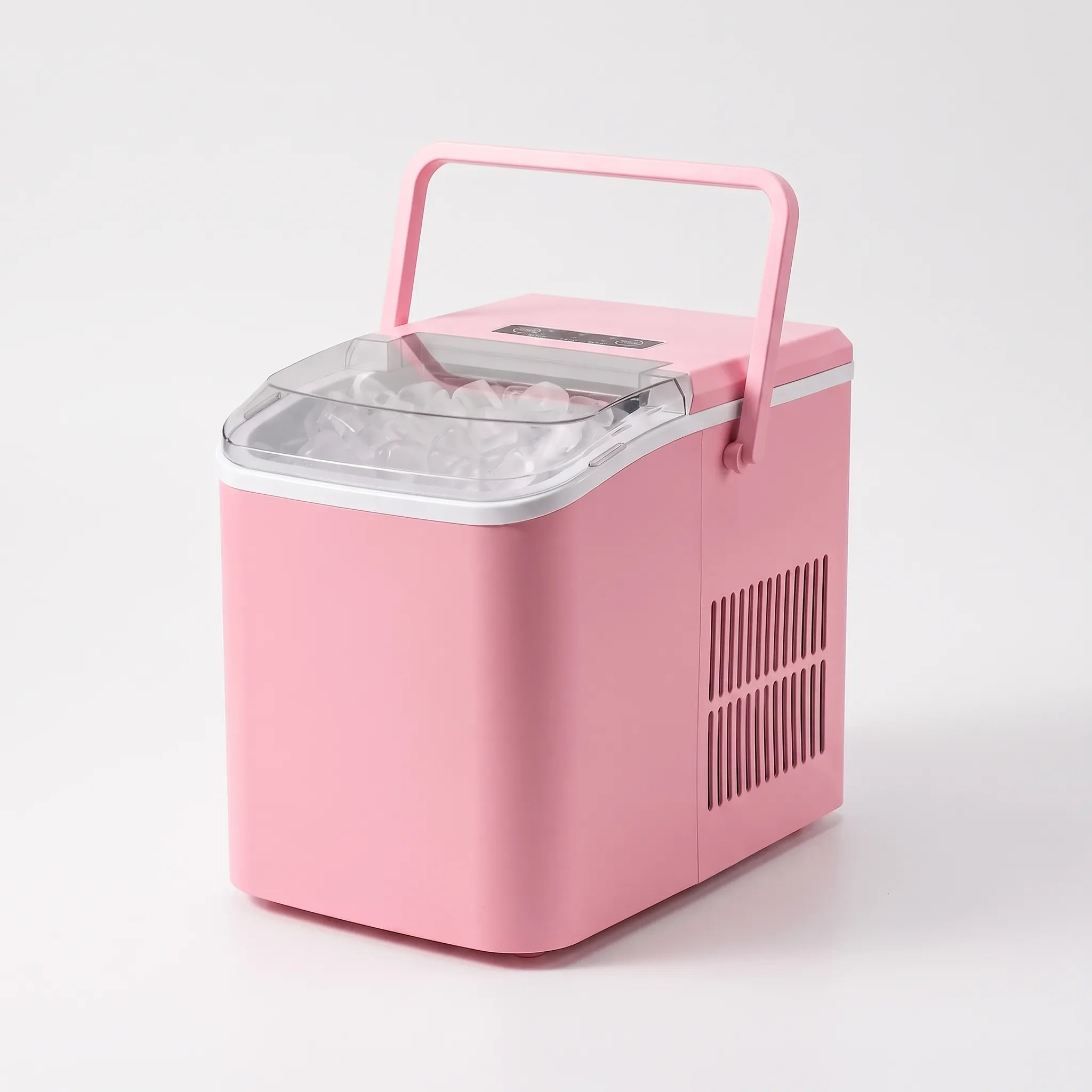 Countertop ice maker producing ice cubes