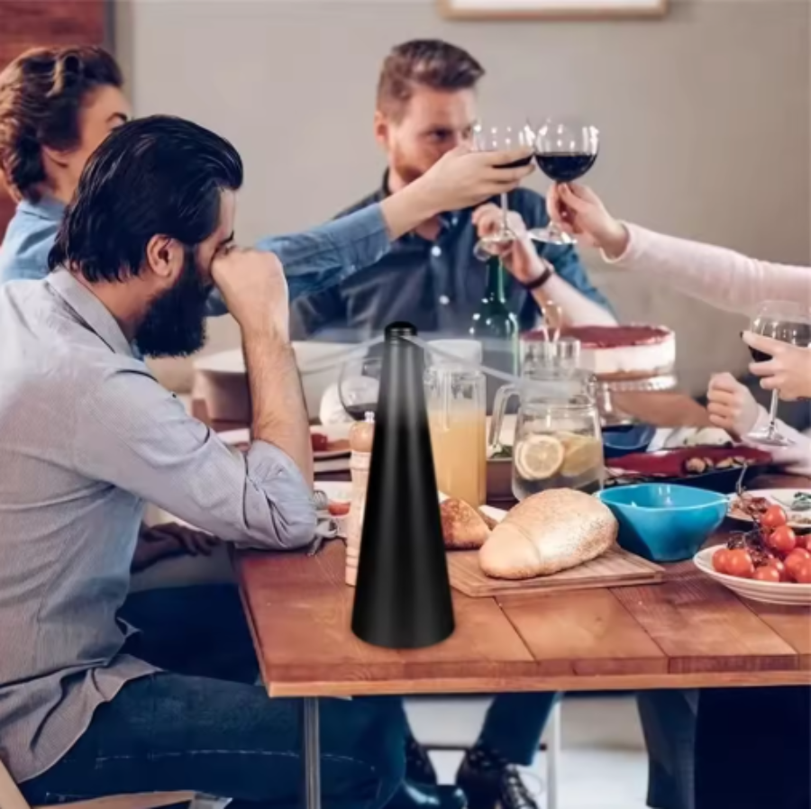 Portable insect repeller fan on a dining table