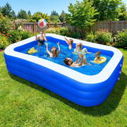 Extra large blue inflatable family swimming pool in a sunny backyard