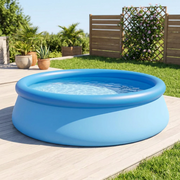 Round inflatable ring swimming pool set up in a sunny backyard
