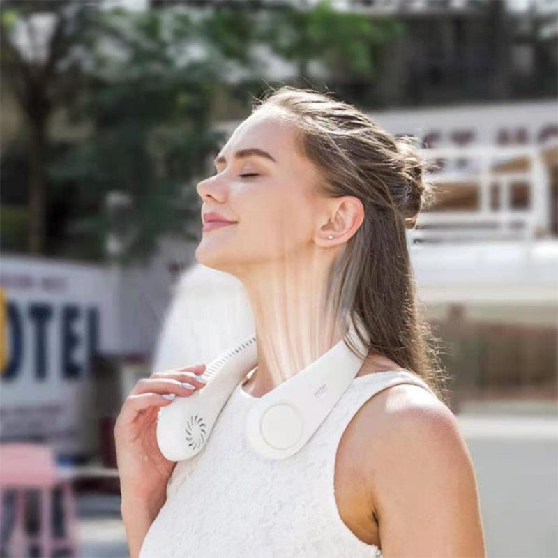 Person wearing a bladeless neck fan